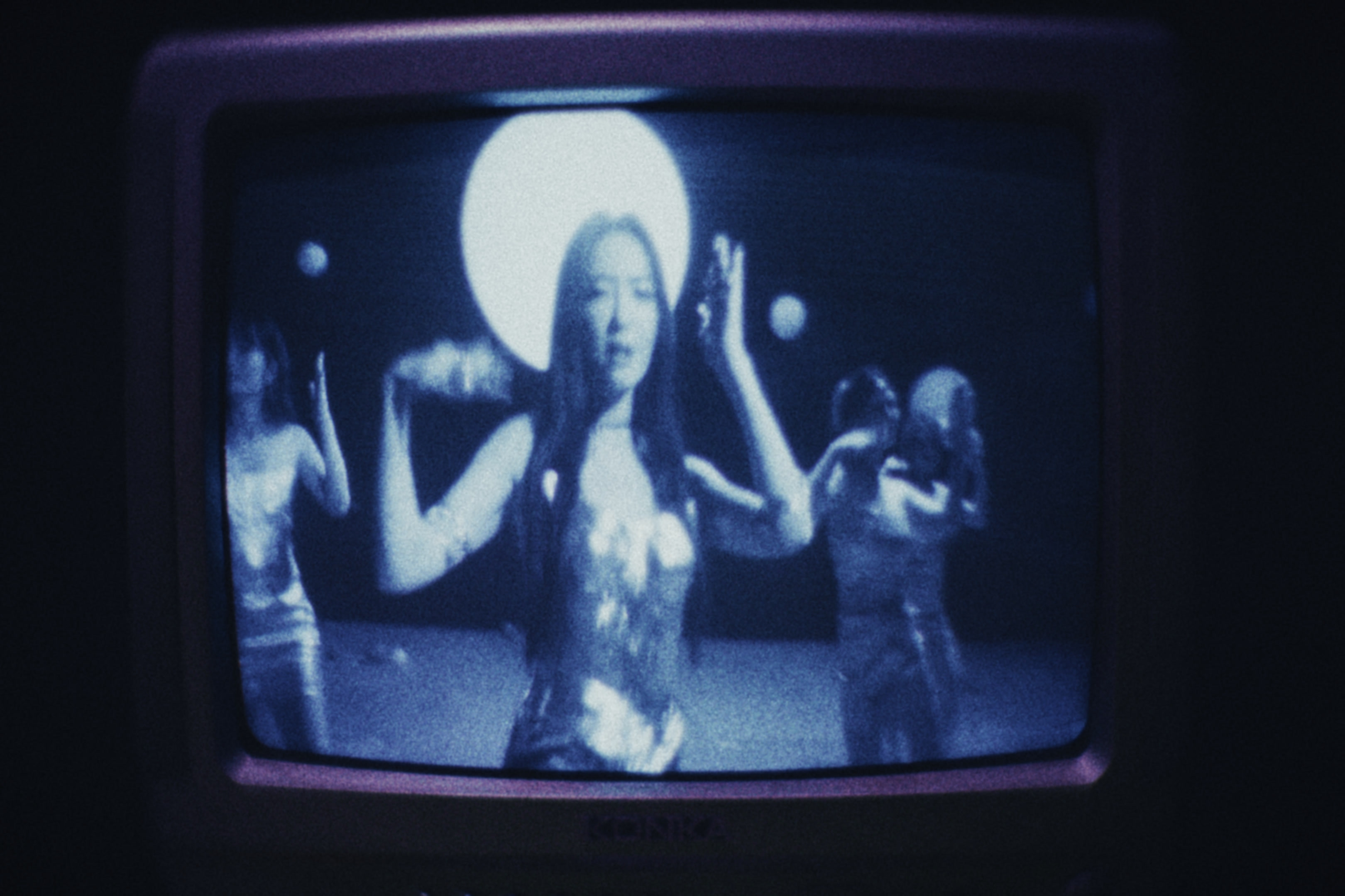 A performance on a blue television screen
