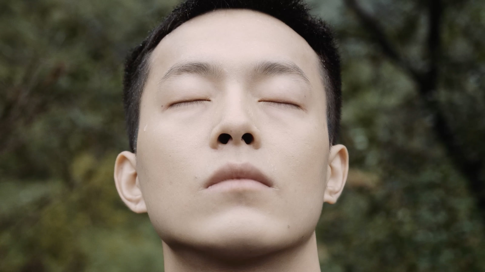 A man with his eyes closed