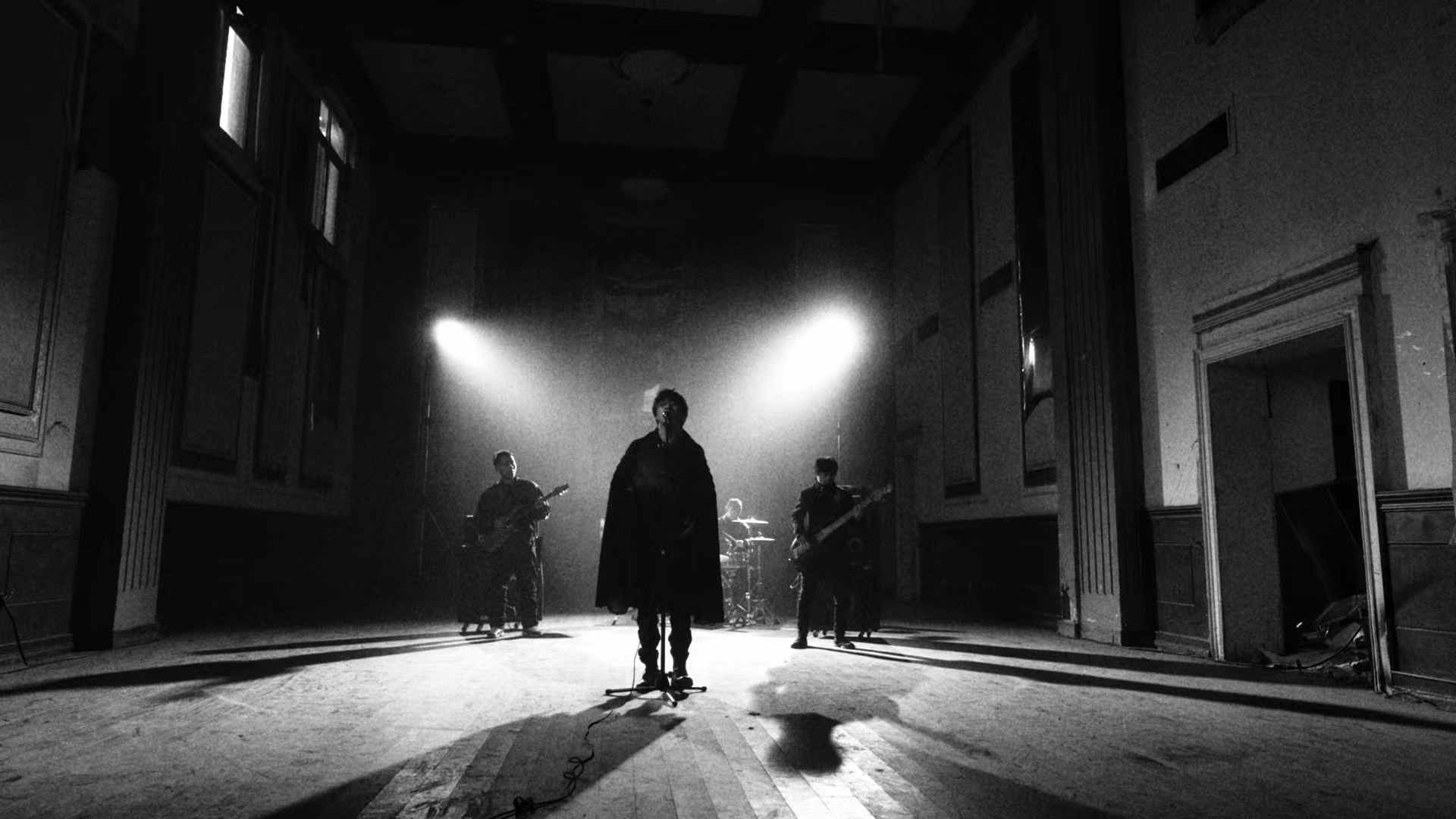 A band performing inside a large hall