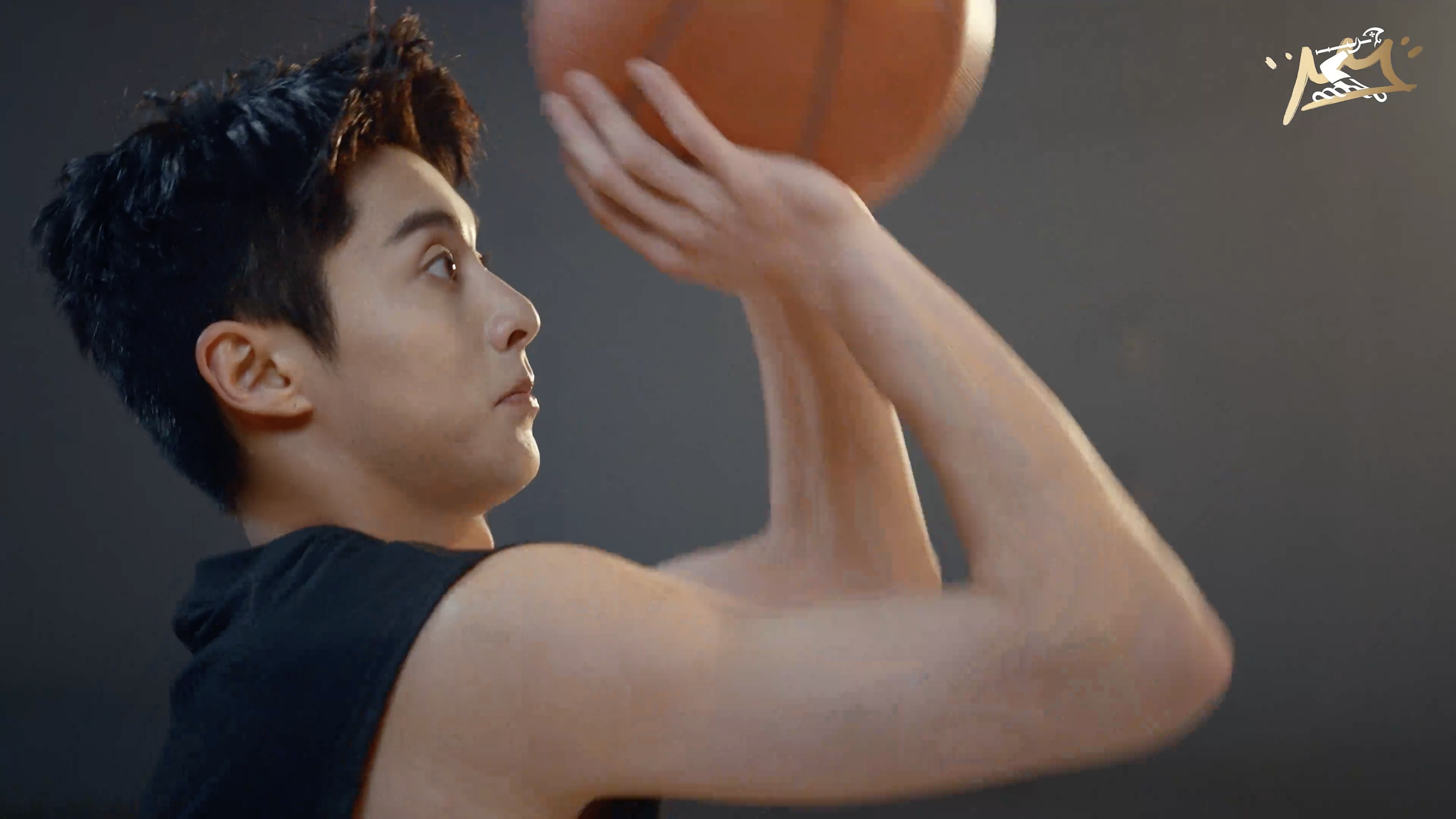 Dylan Wang holding a basketball