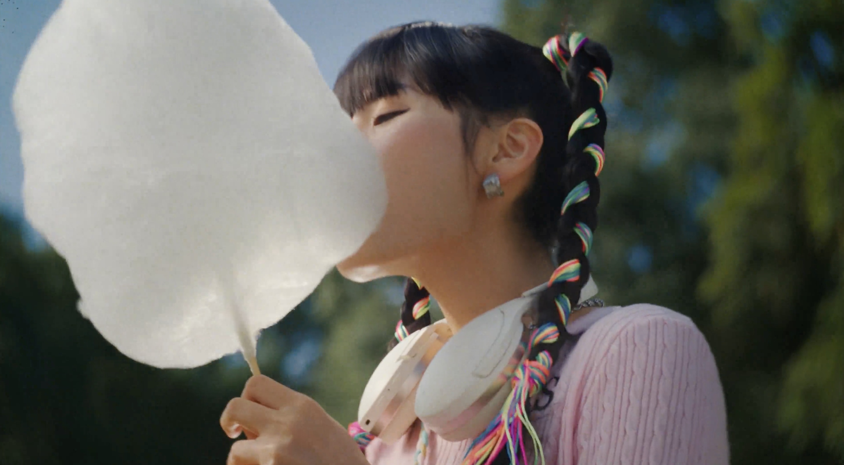 A girl eating cotton candy