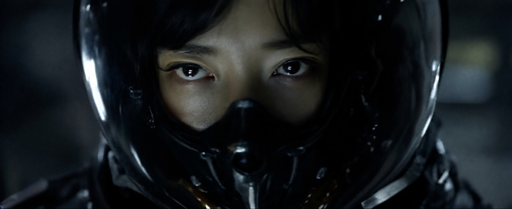 A close portrait inside a futuristic helmet