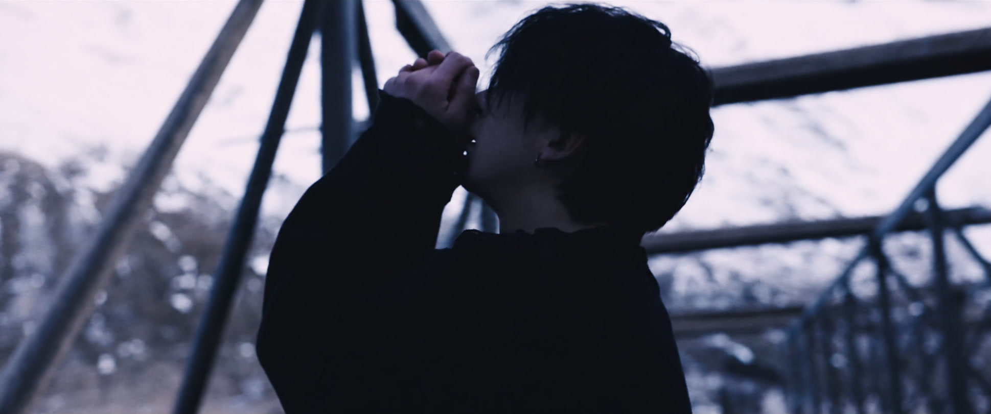 Clasped hands in a winter landscape