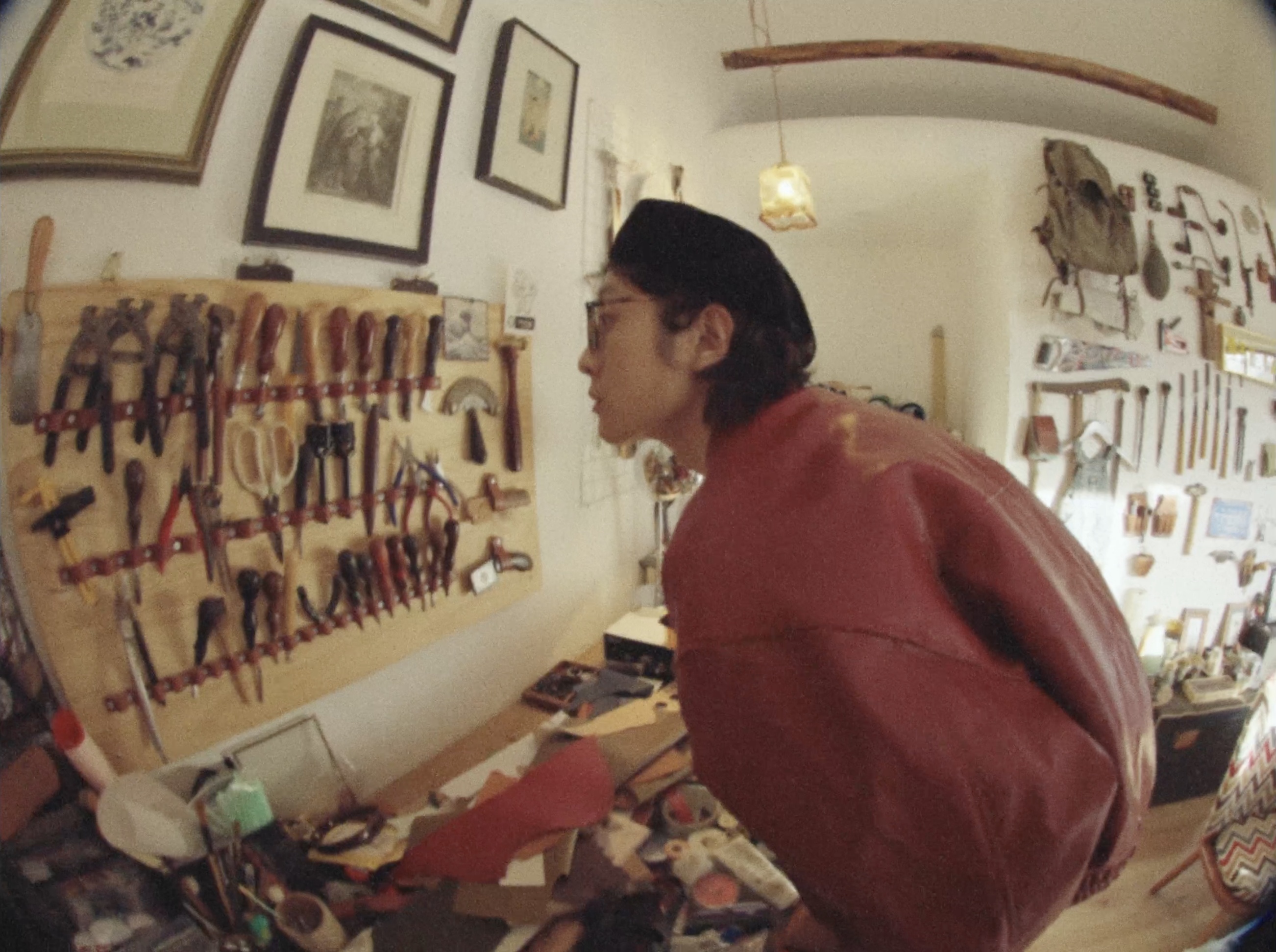 A man in a workshop filled with tools