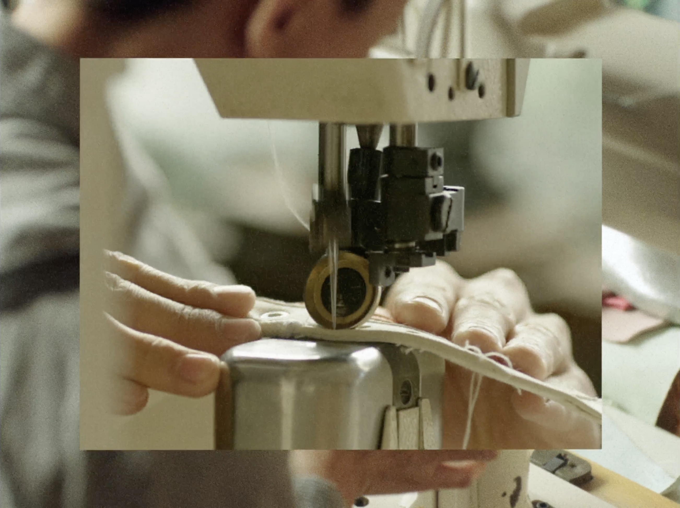 Hands working at a sewing machine